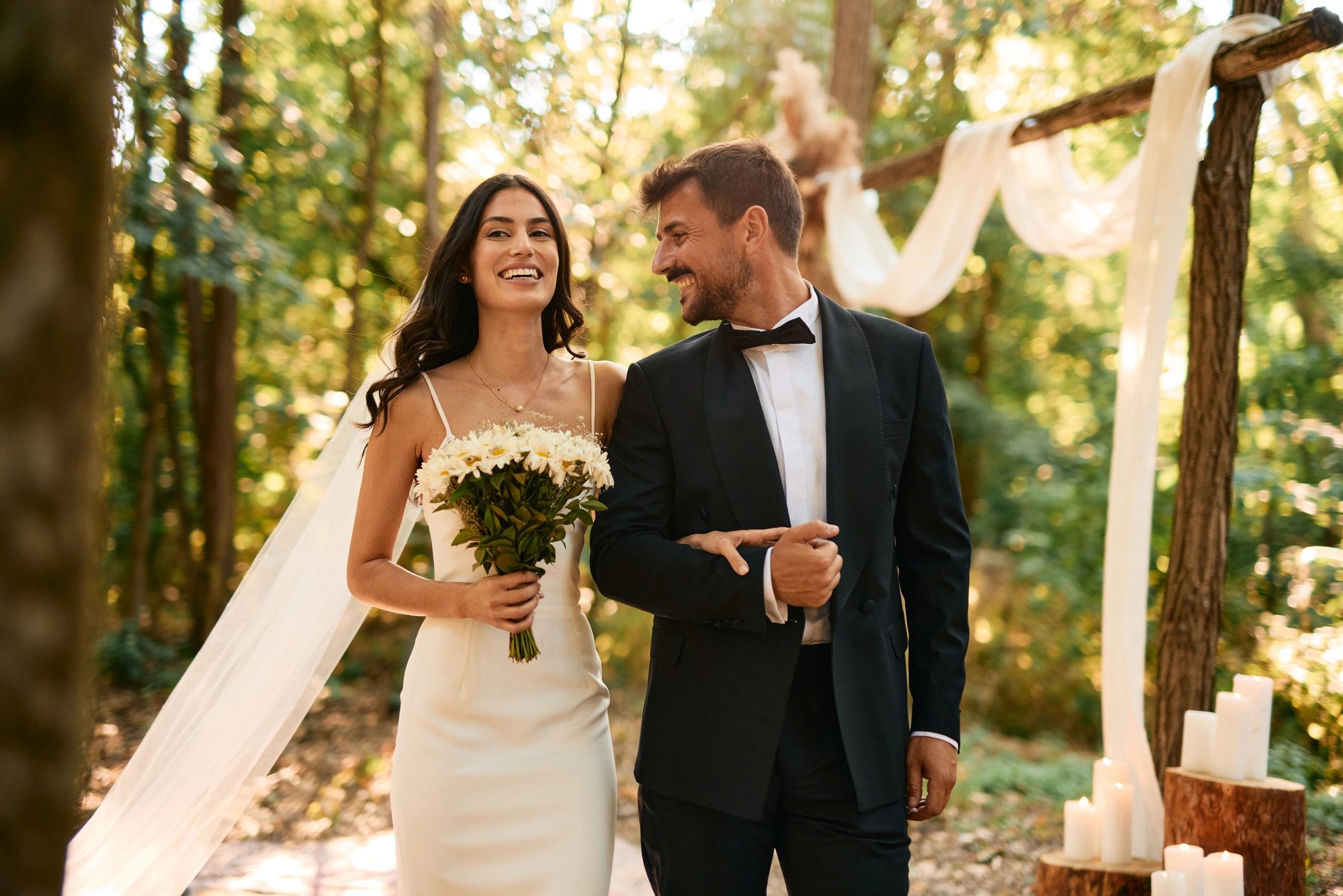 Couple photographed during an outdoor wedding ceremony